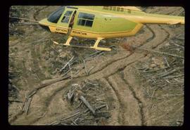 Woods Division - Fire - Helicopter over top of logged landscape