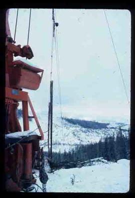Woods Division - High Lead Logging - Crane lifting logs