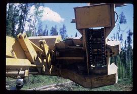 Woods Division - Mechanical Falling - Unique lead mounted onl og loader for limbing and bucking logs