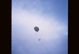 A weather balloon floating in the air