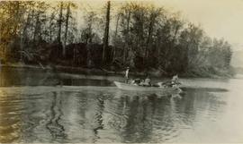 Several men boating down a river
