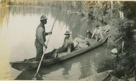 Sam Brown and Indians in dugout canoe on the Naas River or Meziandin Lake