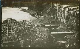 Two men digging beside Meziaden River Falls possibly building a fish ladder