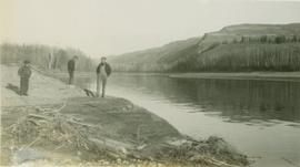 Standing along the shores of the Peace River