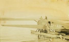 Three men on a floatplane