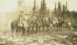 Ten men on horseback next to Bedeaux expedition campsite