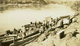 Loading supplies onto canoes at Fort Grahame for a trip down the Finlay River