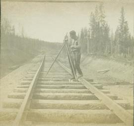 Surveyor on the railroad track