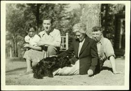 Baxter Family Seated on Ground with Dog
