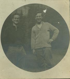 (L-R) Unidentified man standing with R. A. Harlow