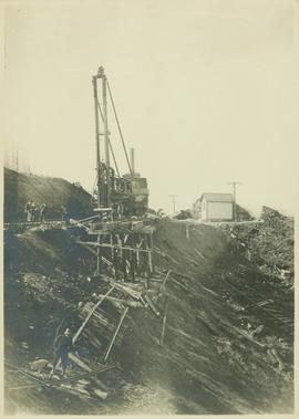 Track laying machinery positioned on the edge of a precipice