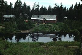 Lodge and buildings behind small pond at Hollyburn