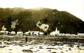 Archdeacon W.H. Collison standing on beach at Kincolith, BC