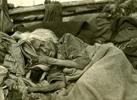 Elder Tsimshian woman sleeping under blanket