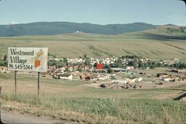 Westmount Village sale sign and farmland near Vernon