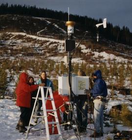 UNBC students installing weather monitoring equipment