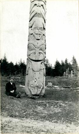 W.E. Collison at totem pole in Masset, Queen Charlotte Islands, BC