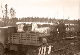 Unloading jeep from military cargo truck