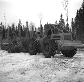 Pulpwood Logging Operations on P.T.S. X91960, Swamp Lake, Prince George Pulp and Paper Ltd. showing close-up of rubber-tired skidder at landing