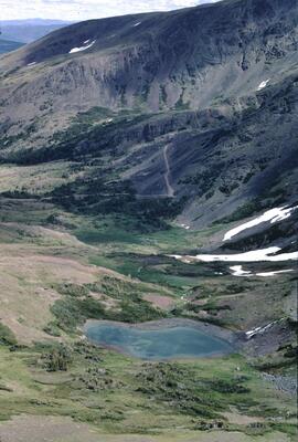 Small lake and mining road in Hunter Basin, Telkwa Range