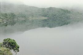 Hill and fog reflections in water at Anthony Island