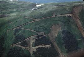 Caterpillar machinery at work on slope for mineral exploration at Ealue Lake