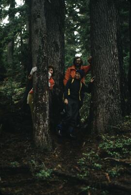 Mike Eddie, Joan Sawicki and companion in forest