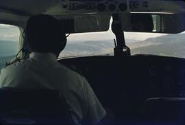 Aircraft pilot flying over the Kootenays