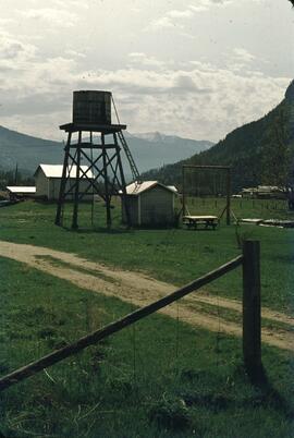 Water tower and pumphouse on farm in the Slocan Valley