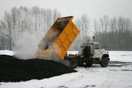 City of Prince George dumptruck dumping compost or asphalt