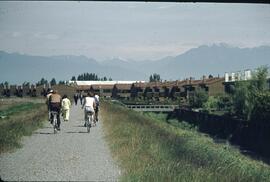 People on path next to townhouses in the Delta-Richmond area