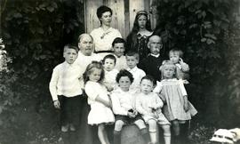 Marion and W.H. Collison posing with grandchildren at Kincolith, BC