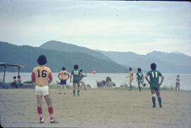 Children playing soccer on beach near Kitimat