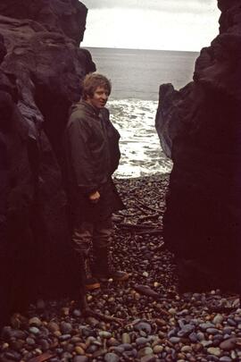 Gary Runka in front of wave eroded rock near Masset