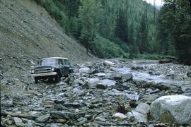 Truck attempting to navigate washed-out road at Goat River