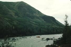 Caterpillar heavy equipment crossing stream at Tuya Lake
