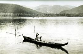 Two men in canoe: Oolichan fishin on Nass River, BC