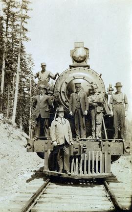 Railway workers on Pacific Great Eastern #52 locomotive