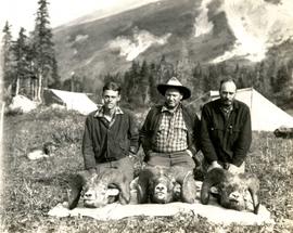 (L-R) George Bates, Harry Snyder and Carrol Paul seated behind their trophy ram heads