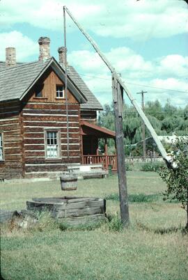 Log cabin and well at Father Pandosy Mission