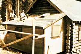 Percy Barr and wife Kathryn Reade Barr (nee Bradshaw) shingling lean-to addition to Aleza Lake lo...