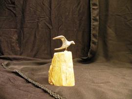 Pewter gull figure mounted on stone