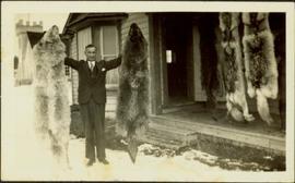 H.F. Glassey with Wolf Pelts