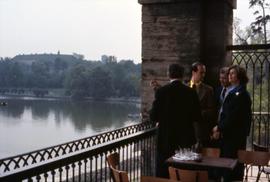 Iona Campagnolo with three men overlooking Lake Constance in Germany