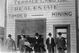 Men in front of Terrace Land Co. building