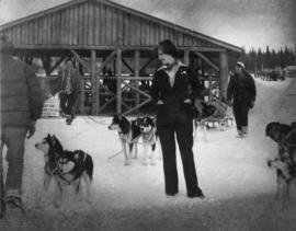 Iona Campagnolo and others with dog sled team at Midnight Sun Pulling Company in Whitehorse