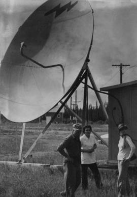 Iona Campagnolo with constituents by a satellite dish