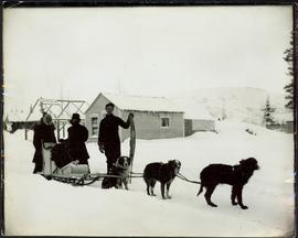 Man & Women with Dogsled Team