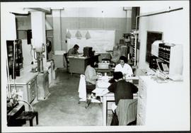 1965 - Clark & Cario Working with Others in Lab