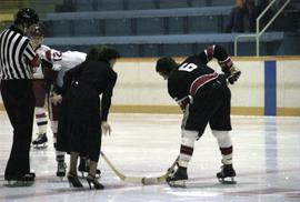 Iona Campagnolo drops hockey puck for face off for game in Kitimat arena
